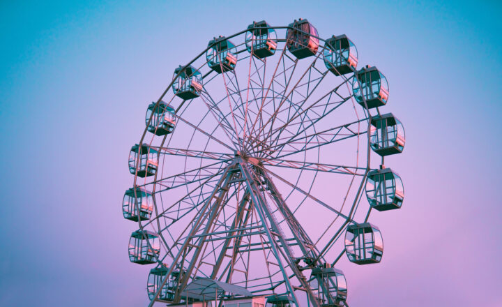 Ferris wheel against the background of the summer sky