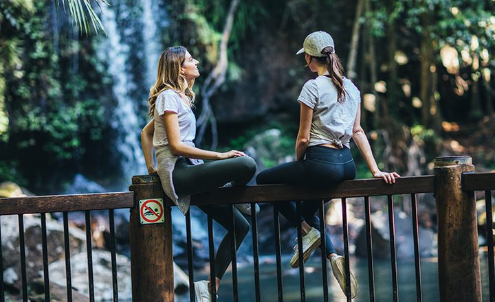 Mount-Tamborine-women-sitting-on-railing-at-lookout